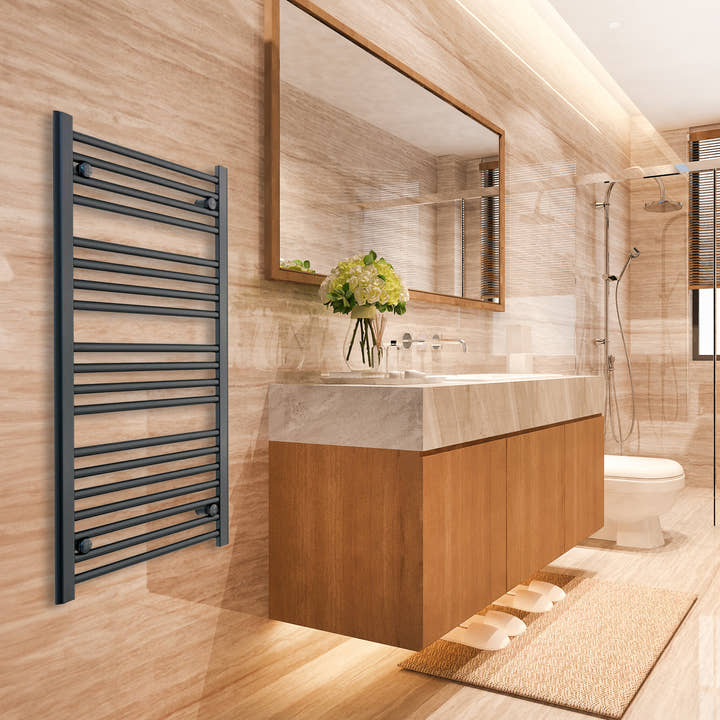 Black towel radiator beside a bathroom vanity