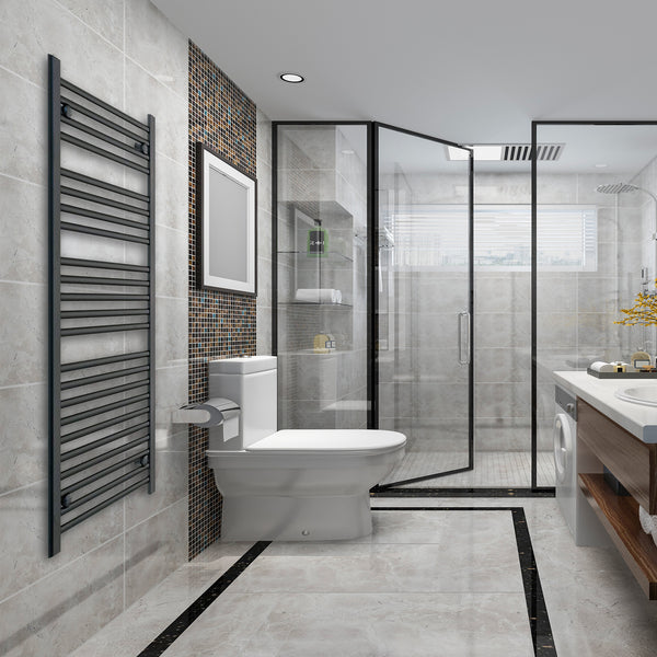 Tall matt black heated towel rail radiator in a bathroom