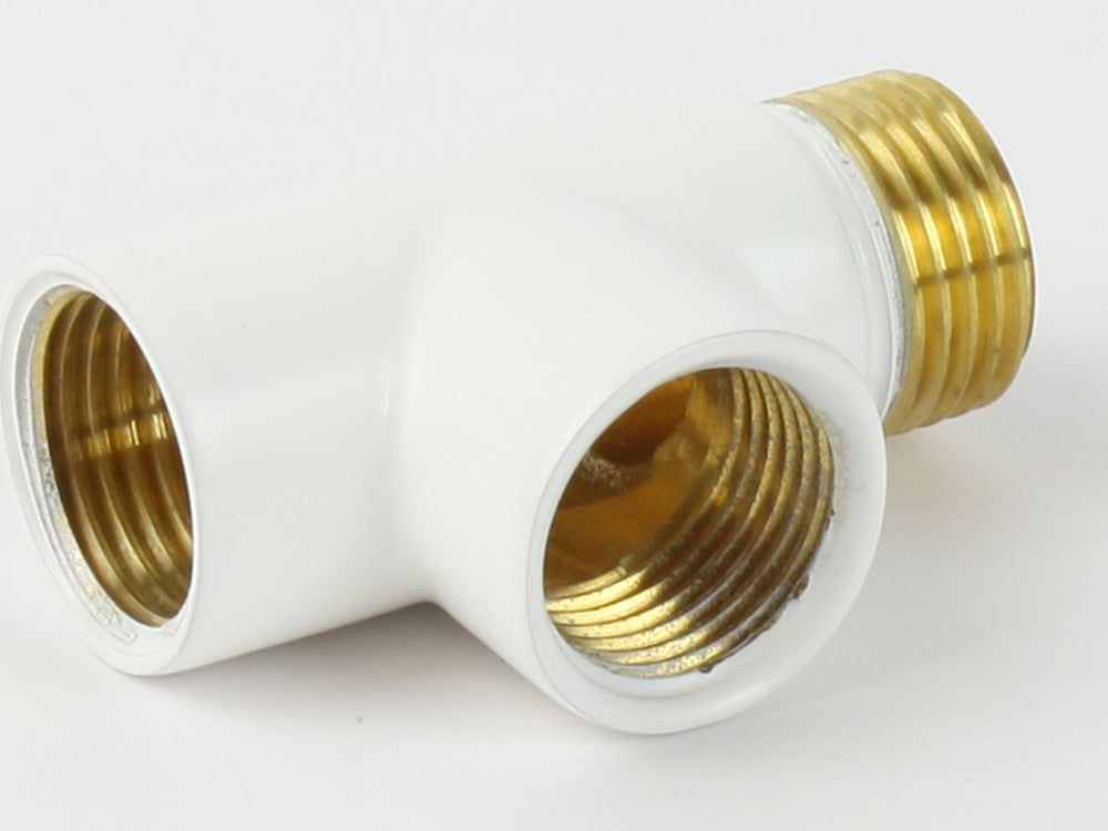 White plastic fitting with brass threaded ends on a white background