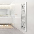 A chrome flat heated towel rail radiator mounted on a wall in a bathroom setting.