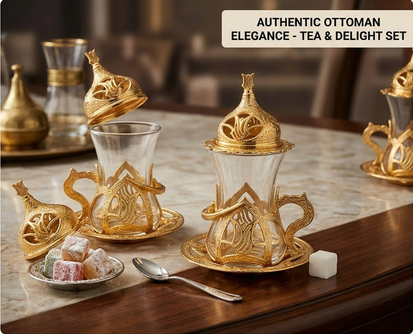 Gold and glass tea set with Turkish delight on a marble surface